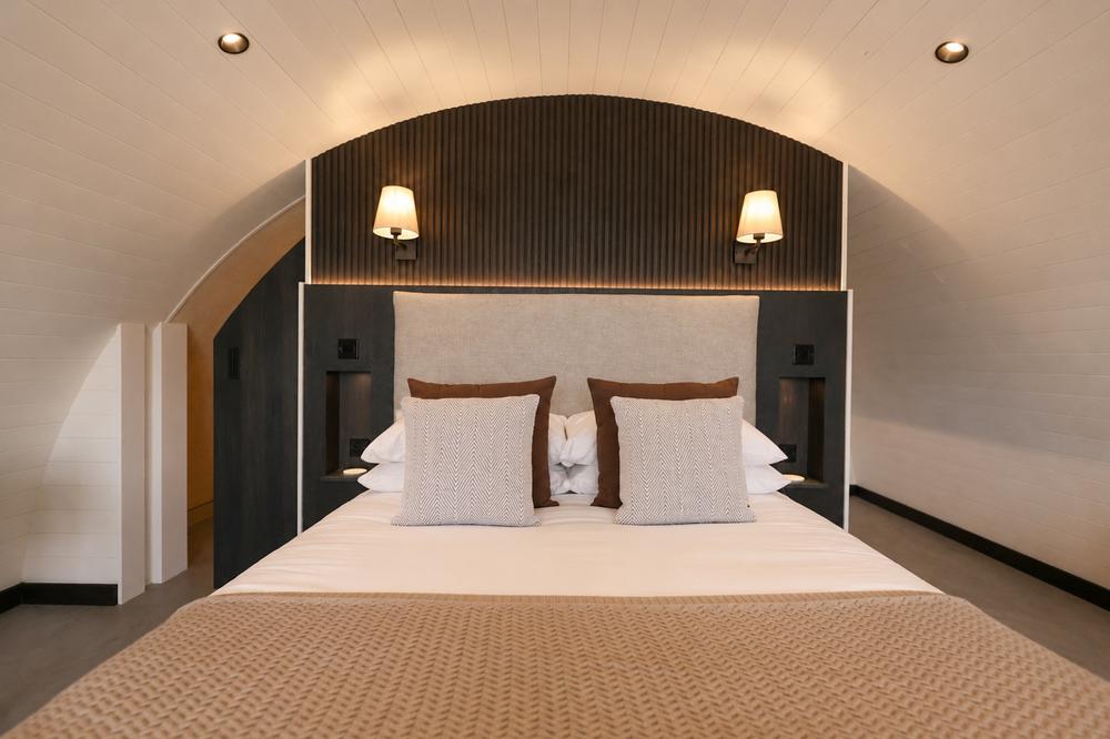 Close-up of the bed's upholstered headboard and cushions