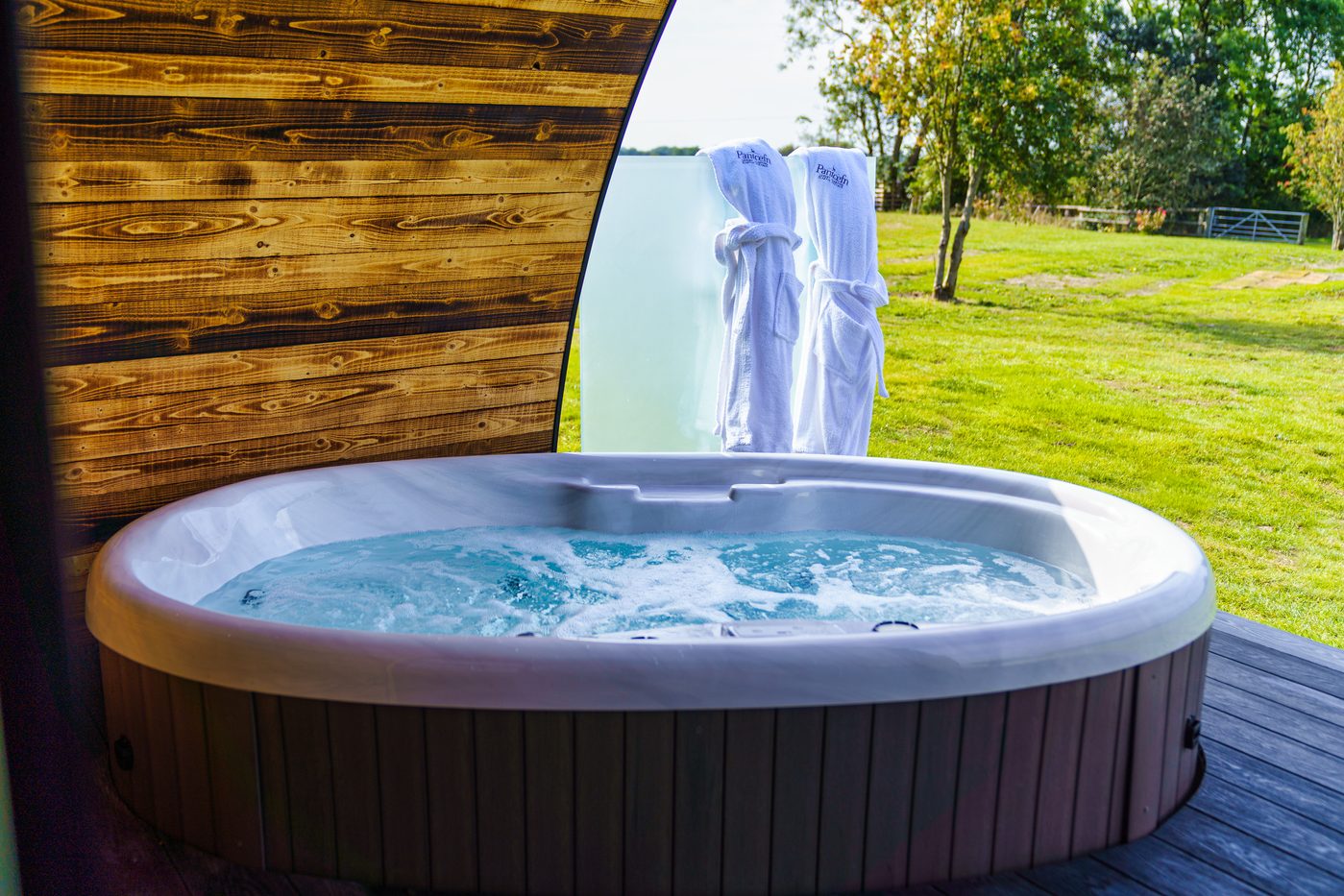 The Piglet Pod hot tub with Pantcefn robes on the privacy screen